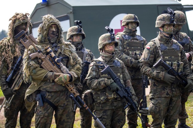 Polish Army soldiers take part in a Lithuanian-Polish Brave Griffin 24/II military exercise near the Suwalki Gap near the Polish border at the Dirmiskes village, in Lithuania on Friday, April 26, 2024. Over 1500 troops and 200 pieces of tactical equipment are rehearsing defence scenarios under the bilateral Lithuanian-Polish Orsha Plan near the Suwalki Gap. (AP Photo/Mindaugas Kulbis)