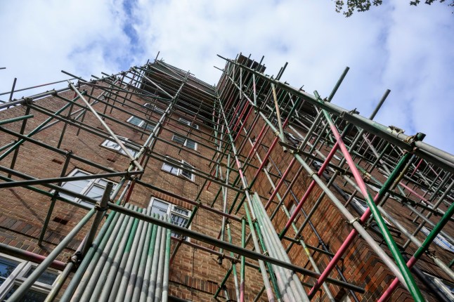 The peaceful haven of Chiswick Village, tucked away between London???s Great West Road and the River Thames in West London, where residents found, due to a decades old legal loophole in a leasing and freehold agreement, developers arriving to build new roof top extensions on all 15 of their blocks to create new penthouse apartments. Pictured here???. Scaffolding at the rear of one of the blocks. See Eleanor Mann Story.