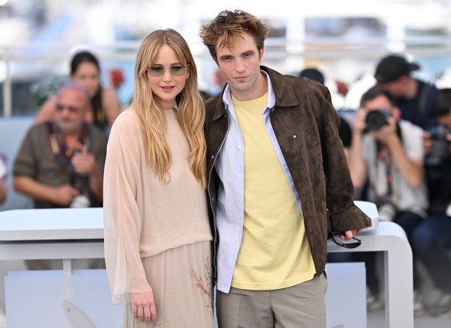 CANNES, FRANCE - MAY 18: US actress Jennifer Lawrence (L) and British actor Robert Pattinson (R) pose during a photocall for the film 'Die, My Love' at the 78th edition of the Cannes Film Festival in Cannes, France on May 18, 2025. (Photo by Mustafa Yalcin/Anadolu via Getty Images)