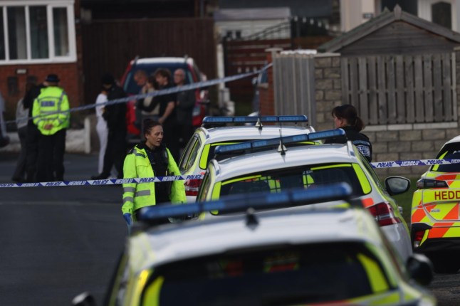 Police at the scene in Presatatyn, North Wales