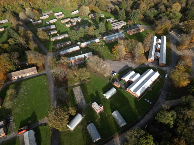 An aerial view shows buildings at Crowborough Training Camp, in Crowborough, south east England on October 28, 2025. The UK government advised the local council on Tuesday that it intends to use the Military Barracks as a temporary asylum accommodation centre for up to 12 months from the end of November 2025. (Photo by JUSTIN TALLIS / AFP) (Photo by JUSTIN TALLIS/AFP via Getty Images)