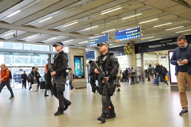 Armed police officers at St Pancras International station, London. Transport Secretary Heidi Alexander said there would be an increased police presence at stations after a number of people were stabbed on a train on Saturday in Cambridgeshire. Picture date: Monday November 3, 2025. PA Photo. Anthony Williams has been charged with 10 counts of attempted murder, one count of actual bodily harm and one count of possession of bladed article following a knife attack on a train in Cambridgeshire. Photo credit should read: Yui Mok/PA Wire