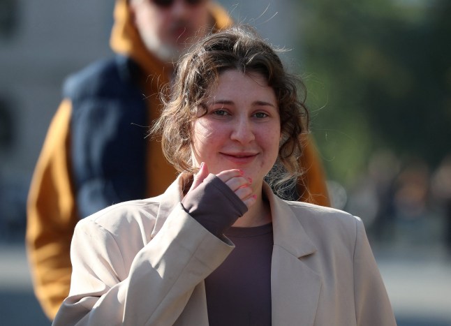 Bella Culley, a British teenager arrested on drug smuggling charges in Georgia, walks towards journalists following a hearing of the city court that released her from custody in Tbilisi, Georgia, November 3, 2025. REUTERS/Irakli Gedenidze