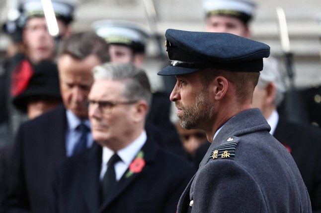 Britain's Prince William, Prince of Wales attends the Remembrance Sunday ceremony at the Cenotaph on Whitehall in central London on November 9, 2025 with Keir Starmer on the background.