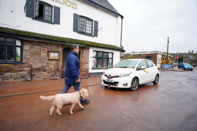 Person walking their dog Monmouth in south-east Wales, after dozens of people were rescued from their homes or evacuated in the town, following severe flooding when the River Monnow burst its banks. South Wales Fire and Rescue declared a major incident in Monmouth in the early hours of Saturday following flooding across the town and surrounding communities. Picture date: Sunday November 16, 2025. PA Photo. Photo credit should read: Ben Birchall/PA Wire