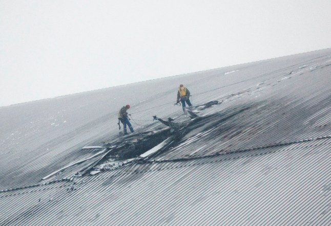 Workers operate on a damaged protective shelter over the remains of the reactor Unit 4 at the Chernobyl nuclear power plant (NPP), near the city of Chernobyl, Ukraine, 14 February 2025, amid the Russian invasion. Ukraine's President Zelensky said on 14 February, that a Russian drone with a 'high-explosive warhead' struck the shelter covering the destroyed Unit 4 of the Chernobyl NPP overnight. A fire was extinguished and radiation levels are being monitored at the site, Ukrainian authorities said.