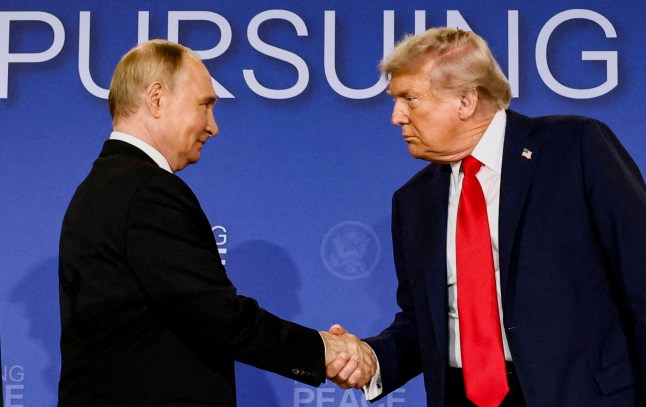 FILE PHOTO: U.S. President Donald Trump and Russian President Vladimir Putin shake hands during a press conference following their meeting to negotiate an end to the war in Ukraine, at Joint Base Elmendorf-Richardson, in Anchorage, Alaska, U.S., August 15, 2025. REUTERS/Kevin Lamarque/File Photo