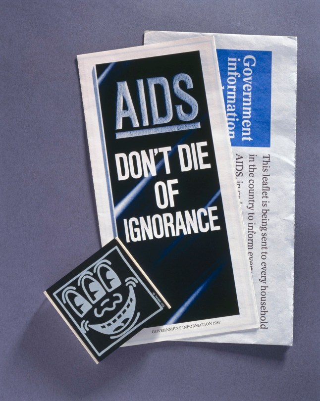 UNITED KINGDOM - DECEMBER 29: Pamphlet titled 'AIDS: Don't Die of Ignorance', envelope marked 'Government Information about AIDS', and condom box by Keith Haring. The AIDS epidemic began in the 1970s and spread unchecked, so that by 1980, AIDS was present in North and South America, Europe, Africa and Australia. The disease can fatally affect the body???s immune system. People can catch human immuno deficiency virus (HIV), the virus that causes AIDS, in several ways, including through sexual contact. The condom is the only method of contraception that can protect against sexually transmitted diseases such as AIDS. In the late 1980s the British Government produced leaflets to raise public awareness of AIDS and promote safe sex. (Photo by SSPL/Getty Images)