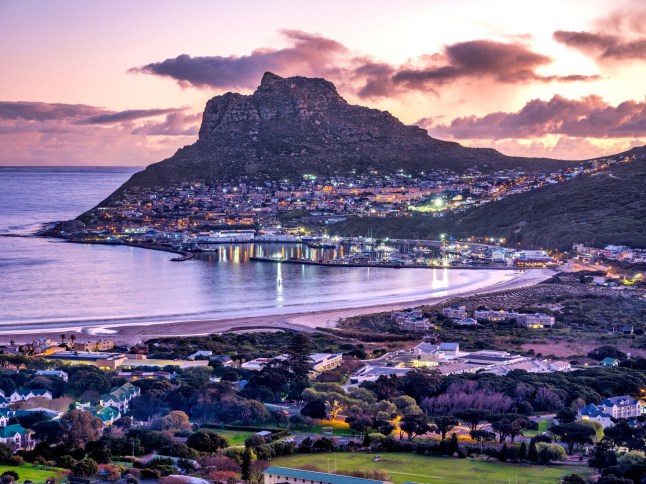Hout bay town, harbour and the fisherman village at the foothill of the Hangberg mountain, Cape Town, South Africa