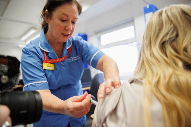 Vaccinator Alison administering the flu jab at the Ulster Hospital Vaccination Centre in Belfast. Picture date: Thursday December 04, 2025. PA Photo. Photo credit should read: Liam McBurney/PA Wire