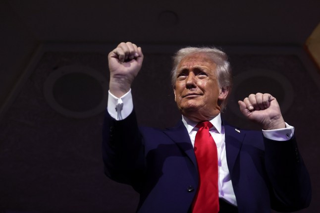 WASHINGTON, DC - DECEMBER 05: U.S. President Donald Trump dances to the final performance of the Village People during the FIFA World Cup 2026 Official Draw at John F. Kennedy Center for the Performing Arts on December 05, 2025 in Washington, DC. (Photo by Hector Vivas - FIFA/FIFA via Getty Images)