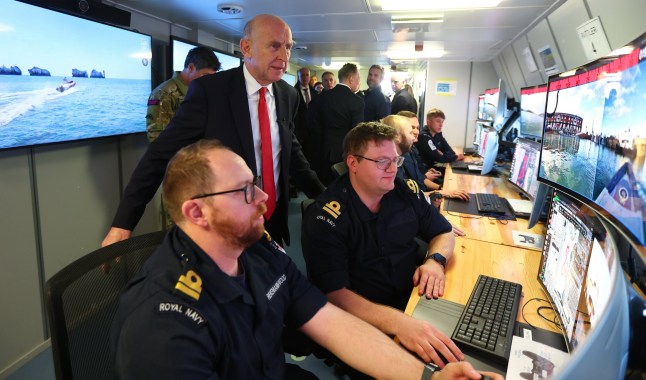 PORTSMOUTH, ENGLAND - DECEMBER 4: Britain's Defence Secretary John Healey meets operating crews of autonomous sea defence vehicles at the unveiling of the Atlantic Bastion programme on December 4, 2025 in Portsmouth, England. Defence Secretary John Healey and the First Sea Lord, General Sir Gwyn Jenkins, visited HMNB Portsmouth to announce details of Atlantic Bastion, the UK's plan to defend undersea cables and pipelines in the North Atlantic against Russian submarines. The hybrid force will utilize autonomous vessels and advanced digital infrastructure, in addition to naval warships and aircraft. (Photo by Peter Nicholls/Getty Images)