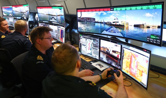 Operating crews of autonomous sea defence vehicles are seen working at Portsmouth Naval Base, during an announcement of details of Atlantic Bastion, the UK's planned highly advanced hybrid force to protect undersea cables and pipelines in the North Atlantic from Russian submarines, a key part of the Strategic Defence Review. Picture date: Thursday December 4, 2025. PA Photo. Photo credit should read: Peter Nicholls/PA Wire