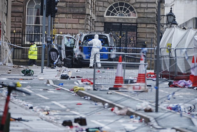 File photo dated 27/05/25 of forensic officers at the scene in Water Street near the Liver Building in Liverpool after a 53-year-old white British man was arrested when a car ploughed into a crowd of people during Liverpool FC's Premier League victory parade. Issue date: Monday December 15, 2025. PA Photo. Paul Doyle, 54, is due to be sentenced on Monday for 31 offences related to the crash, which happened when he ploughed into crowds of fans making their way back from the city's waterfront after the celebration. Photo credit should read: Peter Byrne/PA Wire