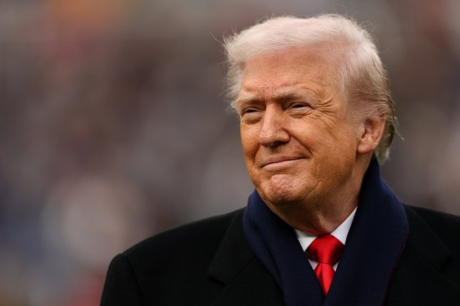 BALTIMORE, MARYLAND - DECEMBER 13: U.S. President Donald Trump smiles from the field before the 126th America's Game between the Army Black Knights and the Navy Midshipmen at M&T Bank Stadium on December 13, 2025 in Baltimore, Maryland. The teams are competing for the Commander-in-Chief's Trophy, with President Trump attending the rivalry for the second consecutive year. (Photo by Patrick Smith/Getty Images)
