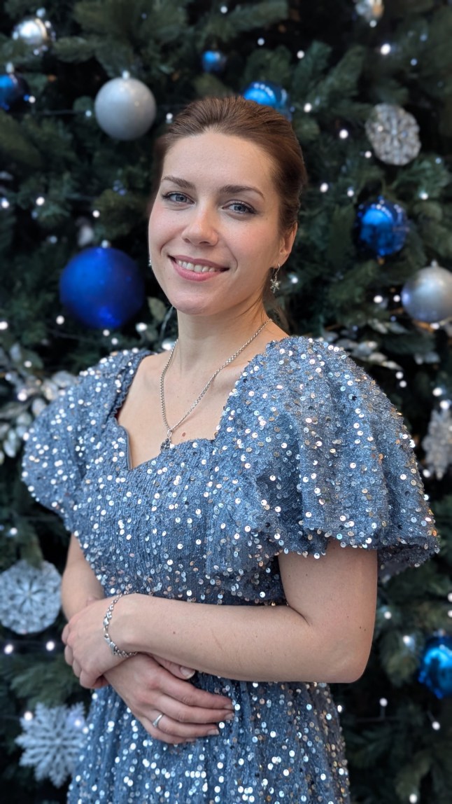 Mariia Kushch wears a blue sparky dress.