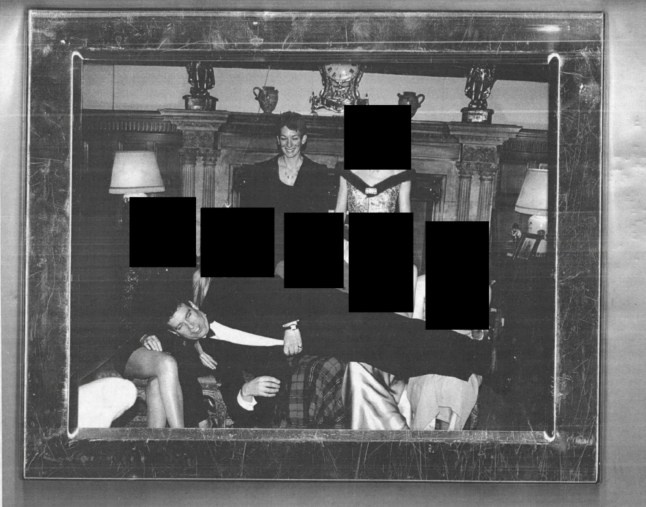 Mandatory Credit: Photo by Department Of Justice/ZUMA Press Wire/Shutterstock (16154365x) DATE and LOCATION UNIDENTIFIED. The Department Of Justice has released files tied to convicted sex offender Jeffrey Epstein. Andrew Mountbatten-Windsor, formerly PRINCE ANDREW, laying across the laps of several women, while GHISLAINE MAXWELL stands in the background. The women's faces are redacted in the photo. Justice Department Releases Epstein Photos - 19 Dec 2025