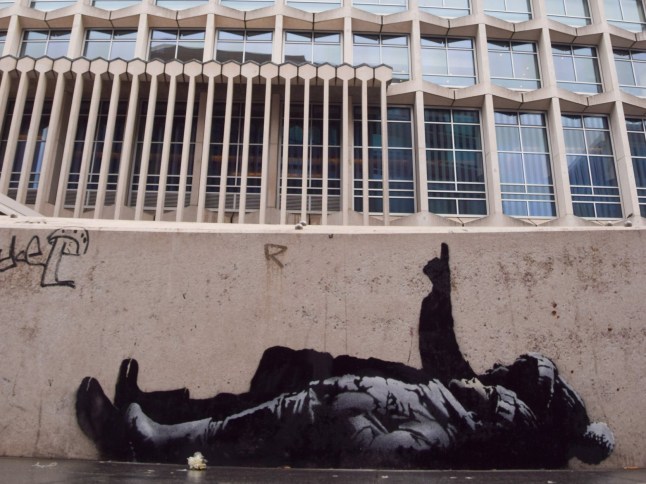 Mandatory Credit: Photo by Vuk Valcic/ZUMA Press Wire/Shutterstock (16168860b) A new artwork, suspected to be by elusive street artist Banksy, has appeared outside Centre Point and Tottenham Court Road Station. The artwork depicts two children lying on their backs and pointing upwards. The artwork has not yet been confirmed as a genuine Banksy. Suspected New Banksy Artwork Outside Centre Point, London, England, United Kingdom - 21 Dec 2025