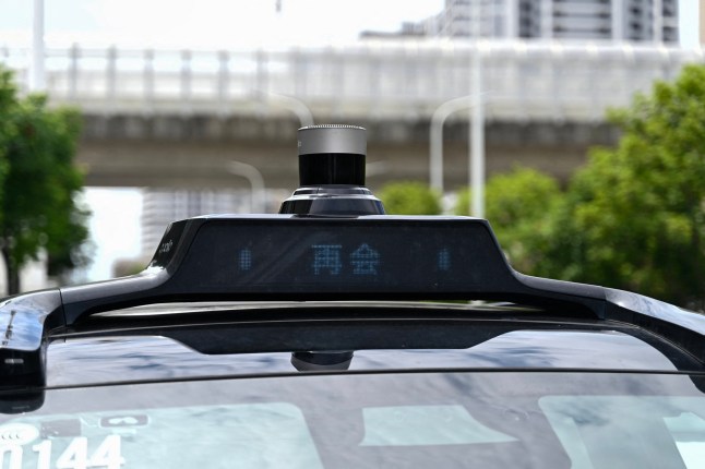 The photo taken on August 1, 2024 shows a sensor on the roof of a driverless robotaxi autonomous vehicle, developed as part of tech giant Baidu's Apollo Go self-driving project, in Wuhan, China