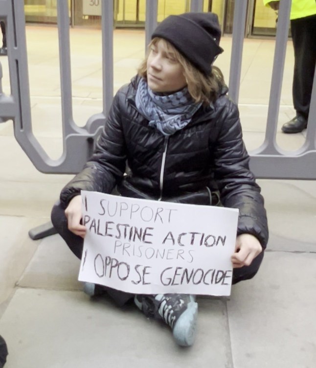 Screen grab taken from handout video dated 23/12/25 issued by Prisoners for Palestine of climate activist Greta Thunberg being spoken to by City of London Police officers during a protest in support of the Palestine Action protesters on hunger strike in prison, at the offices of Aspen Insurance at Plantation Place in the City of London. Picture date: Tuesday December 23, 2025. PA Photo. Photo credit should read: Handout/Prisoners for Palestine/PA Wire NOTE TO EDITORS: This handout photo may only be used for editorial reporting purposes for the contemporaneous illustration of events, things or the people in the image or facts mentioned in the caption. Reuse of the picture may require further permission from the copyright holder.