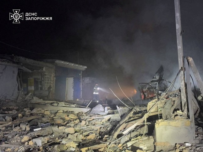 A rescuer works at the site of a Russian air strike, amid Russia's attack on Ukraine, in Zaporizhzhia, Ukraine, in this handout picture released December 24, 2025. Press service of the State Emergency Service of Ukraine in Zaporizhzhia/Handout via REUTERS ATTENTION EDITORS - THIS IMAGE HAS BEEN SUPPLIED BY A THIRD PARTY. MUST NOT OBSCURE LOGO.