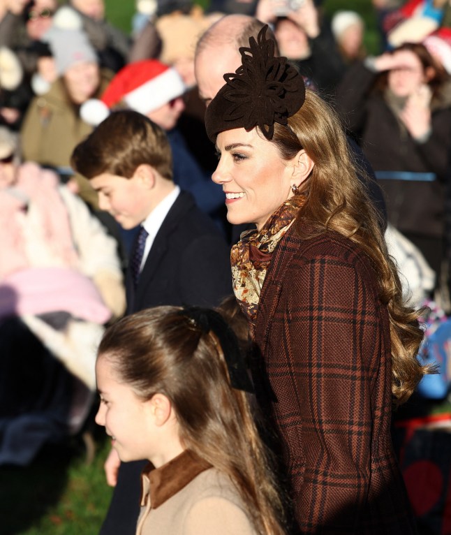 Britain's Catherine, Princess of Wales and her husband Britain's Prince William, Prince of Wales (obscured) arrive with their children Britain's Prince George of Wales, Britain's Prince Louis of Wales (obscured) and Britain's Princess Charlotte of Wales for the Royal Family's traditional Christmas Day service at St Mary Magdalene Church on the Sandringham Estate in eastern England.