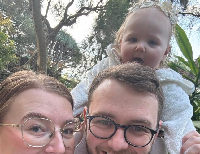 Isobel is pictured with her parents, Tamara and Aaron / A two-year-old girl has died after falling in a garden pond moments after going missing during a family gathering on Christmas Day. The toddler, named Isobel, is said to have wandered into her parents' garden in Doncaster, South Yorkshire, while the family were playing with their presents on December 25.