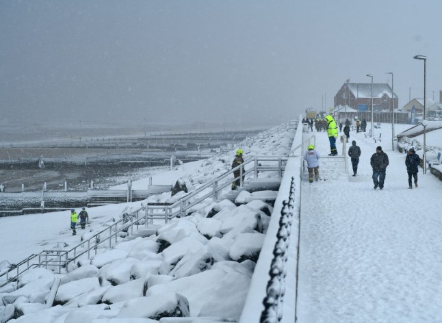 Emergency services on the beach at Withernsea following the tragic deaths of two people in the sea