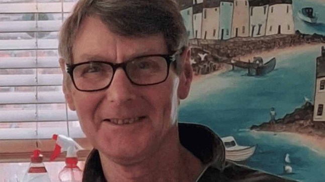 Close up shot of a man wearing glasses