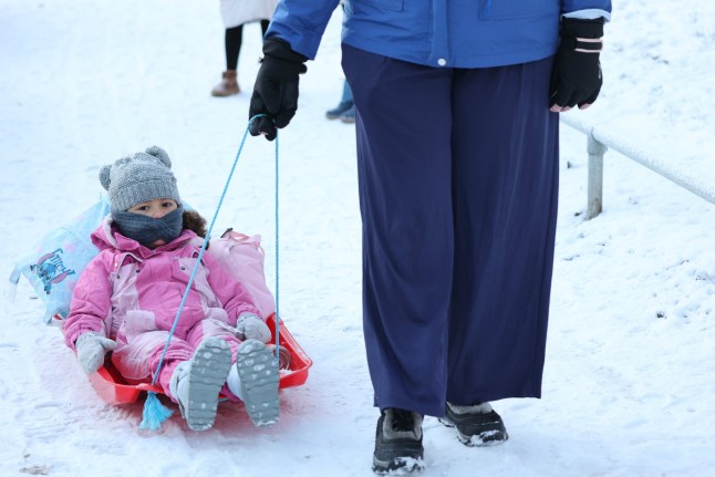 Mum Laura taking her family to school near Warley Woods in Birmingham. The Met Office is warning of disruption to travel on Monday morning as many people return to work and school following the Christmas break. Photo released 05/01/2026