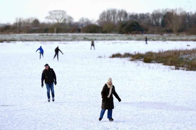 People skate on a frozen flooded field in Upware, Cambridgeshire. The Cambridgeshire Fens were the birthplace of British speed skating and require four nights of frost, with a temperature of -4 or colder and little or no thawing during the days in between, to make ice strong enough to skate on. Picture date: Monday January 5, 2026. PA Photo. Temperatures will struggle to get above freezing as many people return to school or work after the festive period. A string of snow and ice warnings are in place across the UK as the Met Office has warned that cold conditions would bring a range of wintry hazards for the next few days. Photo credit should read: Joe Giddens/PA Wire