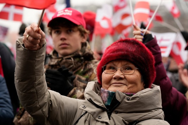 Protesters wave Greenlandic flags as they take part in a rally under the slogans 'hands off Greenland' and 'Greenland for Greenlanders', in front of City Hall in Copenhagen, Denmark on January 17, 2026. (Photo by Emil Helms / Ritzau Scanpix / AFP via Getty Images) / Denmark OUT