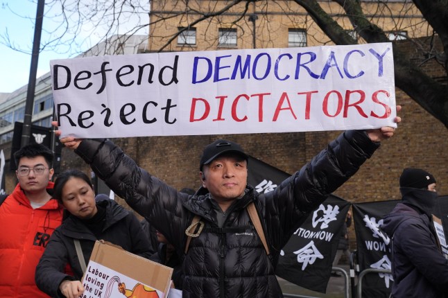 NOTE DEPICTIONS AND LANGUAGE ON PLACARDS Representatives of the Inter-Parliamentary Alliance on China, along with other groups, demonstrate outside Royal Mint Court, London, the site of the proposed new Chinese embassy. Picture date: Saturday January 17, 2026. PA Photo. Photo credit should read: Lucy North/PA Wire